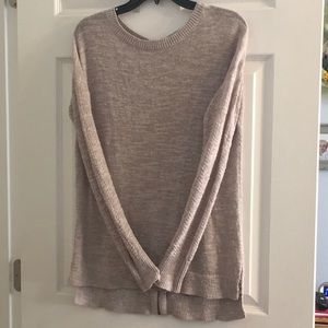 Tunic length sweater with zipper detail.